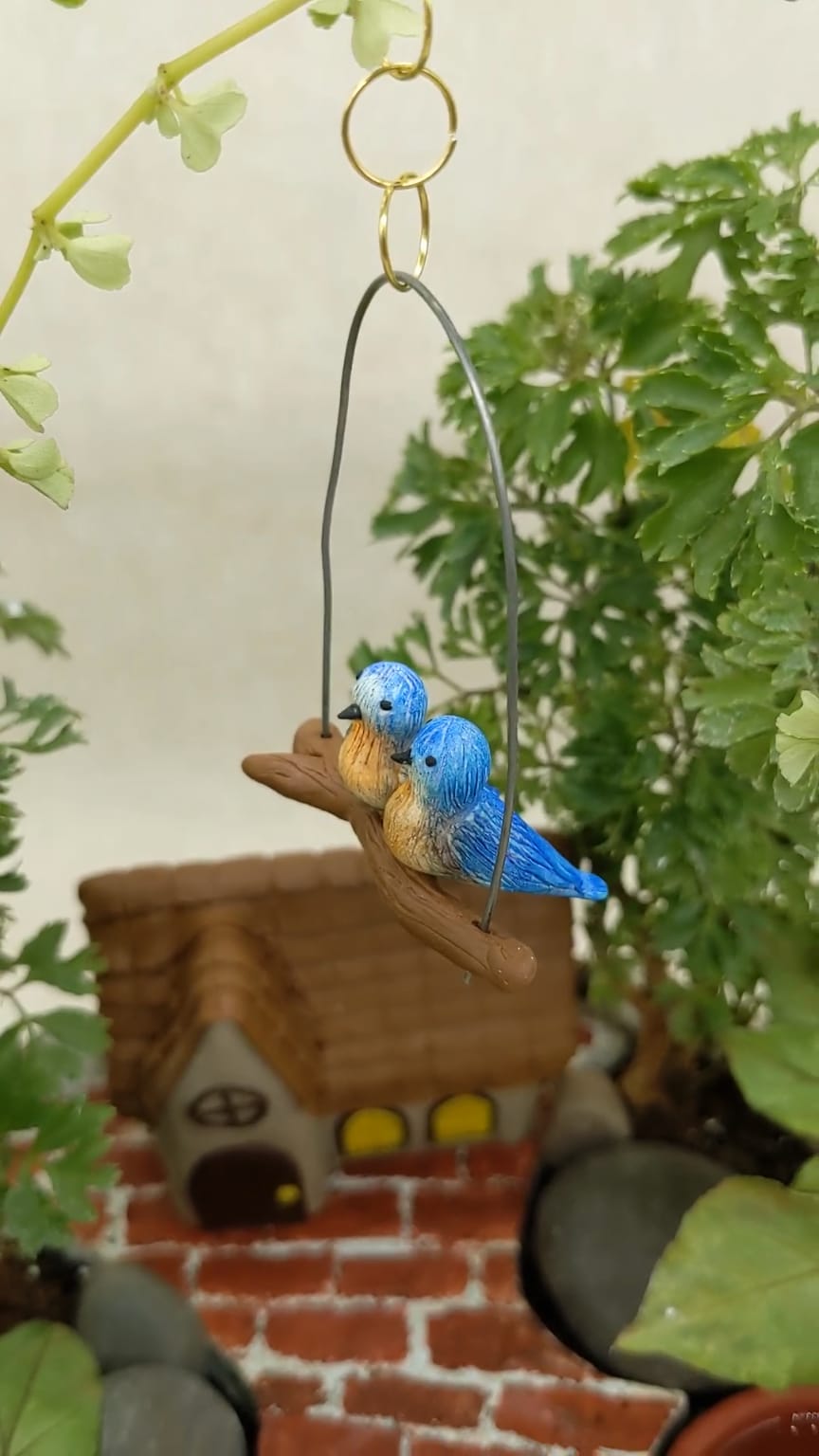 Miniature Birds on branch