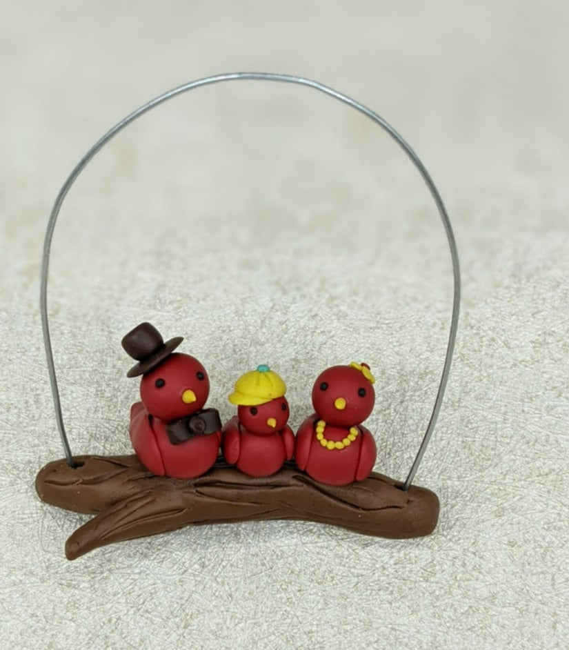 Miniature Bird Family on Branch
