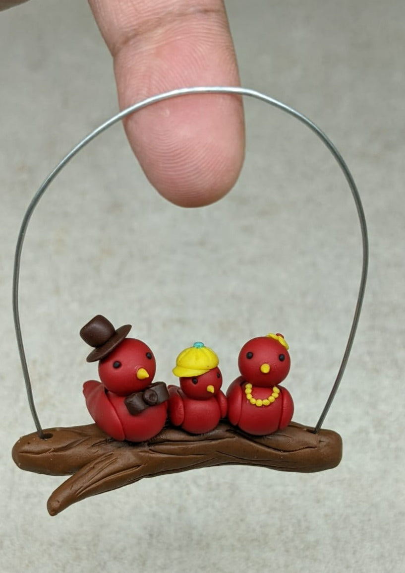 Miniature Bird Family on Branch