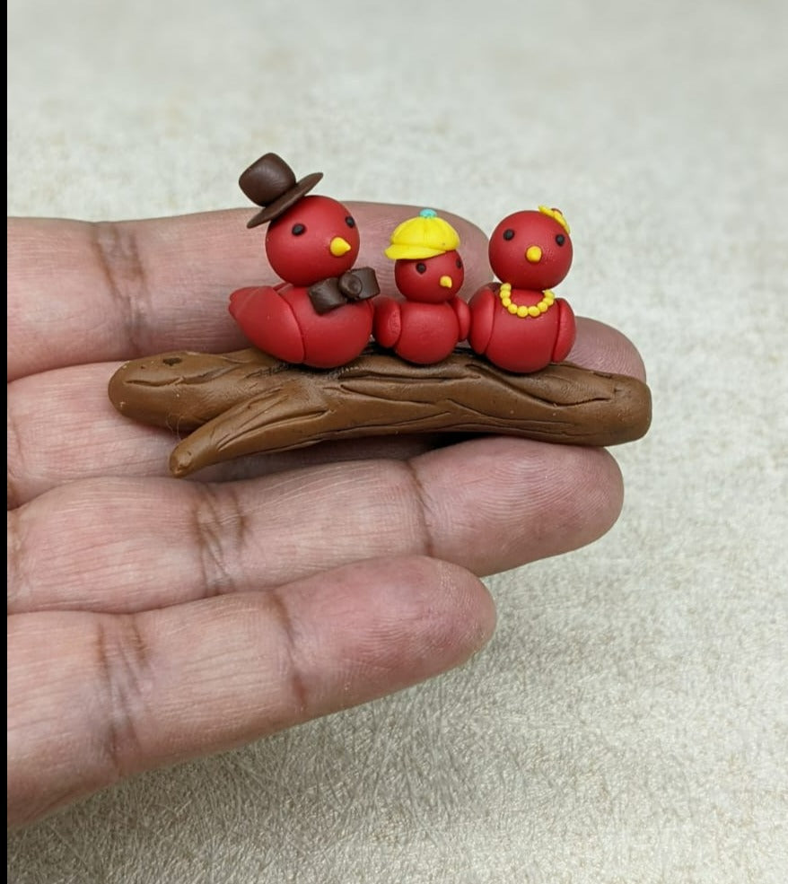 Miniature Bird Family on Branch