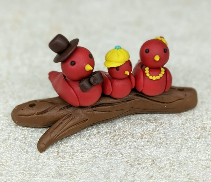 Miniature Bird Family on branch