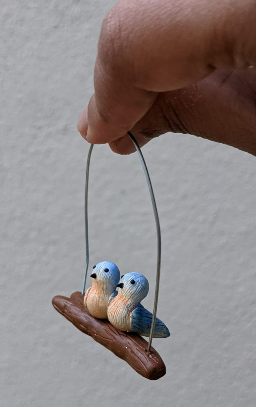 Miniature Birds on branch