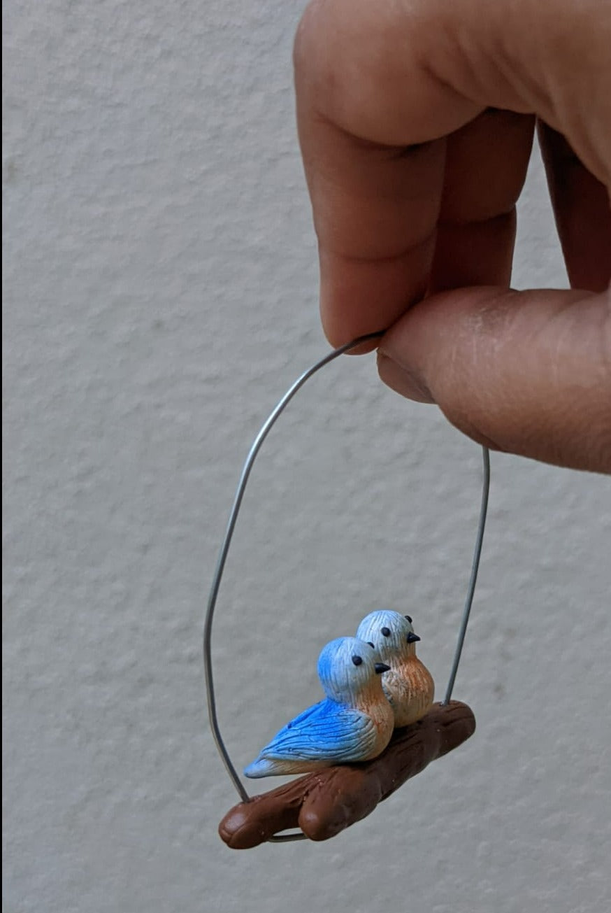 Miniature Birds on branch