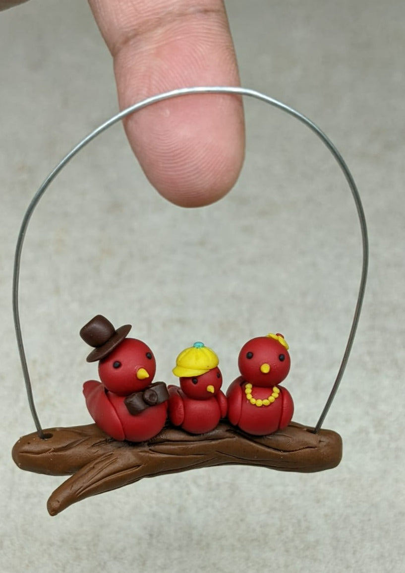 Miniature Bird Family on branch